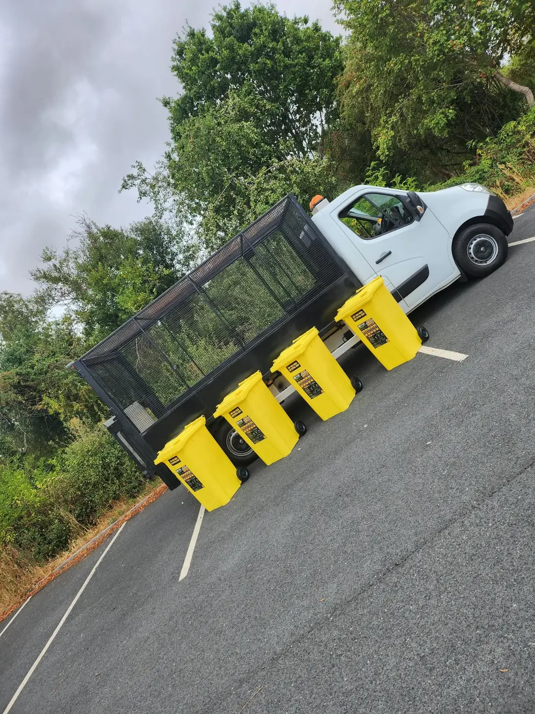 MR VAN cage vehicle with four yellow bins ready for a fortnightly collection round