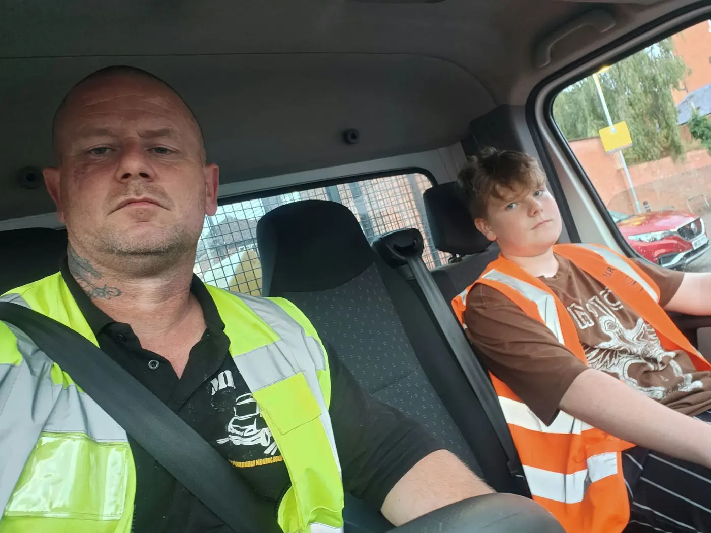 MR VAN Removals and Clearance staff member in safety clothing travelling to a job
