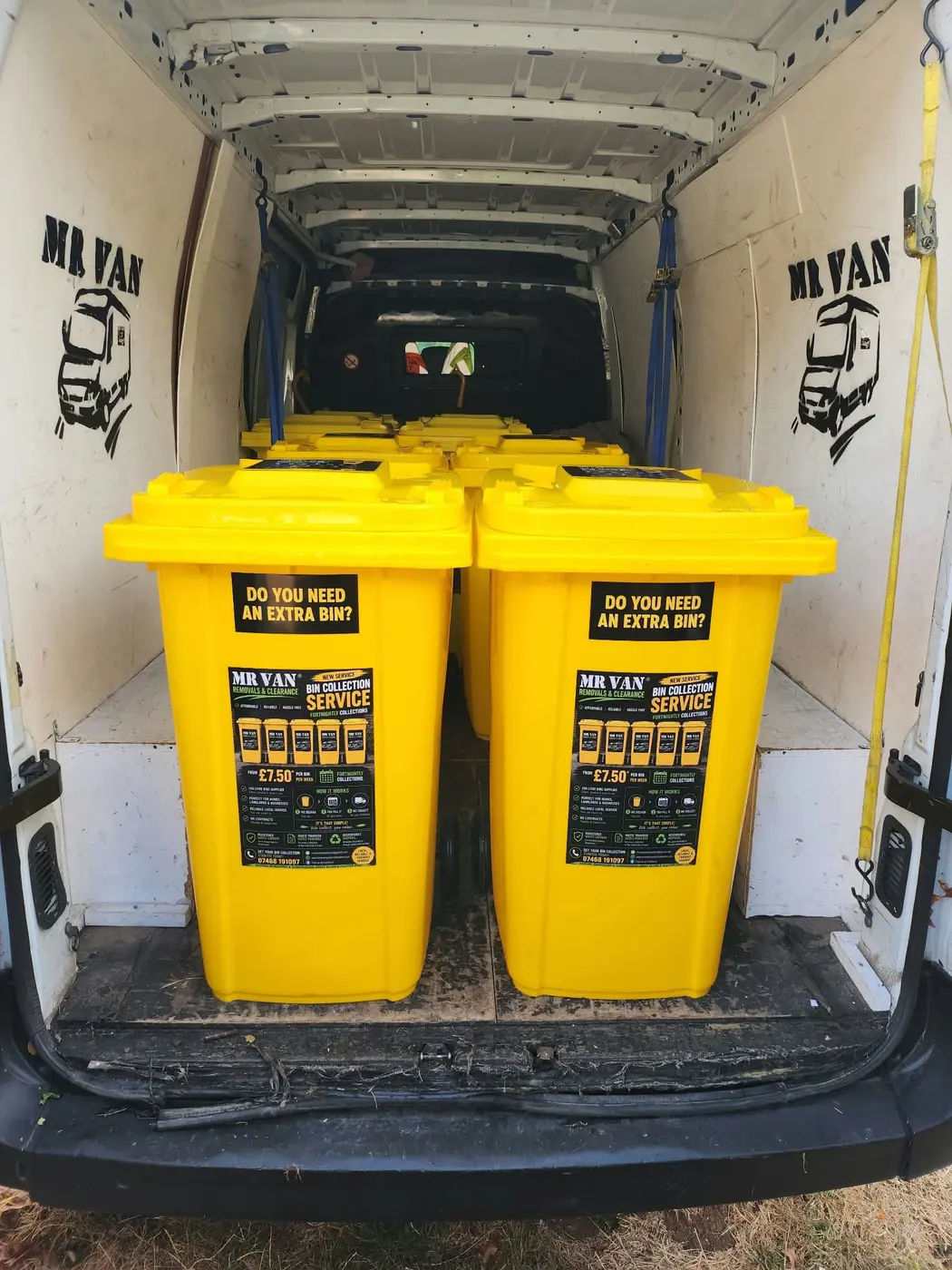 Two yellow 240 litre MR VAN bins secured inside the company van for delivery